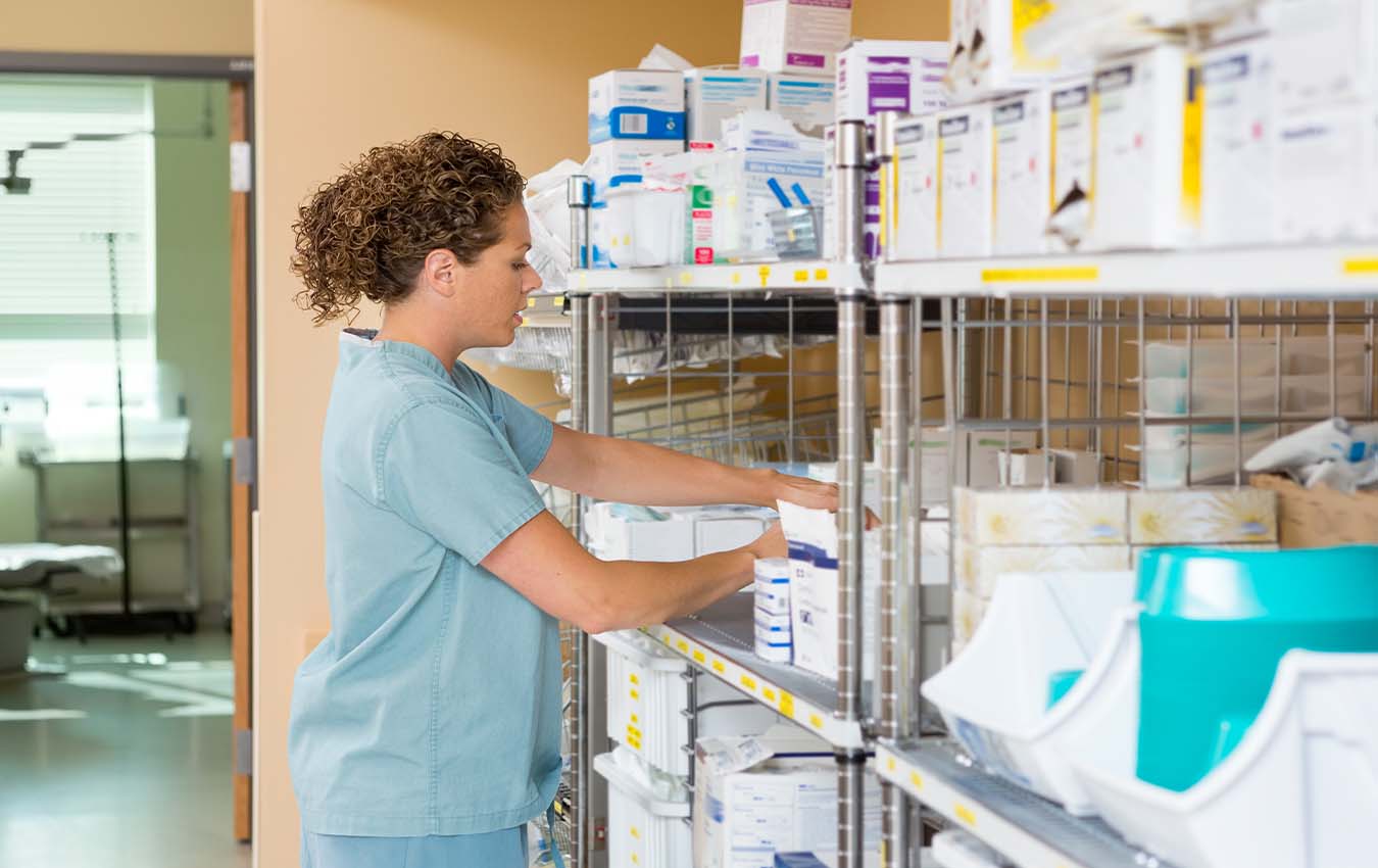 Dental assistant in stock room